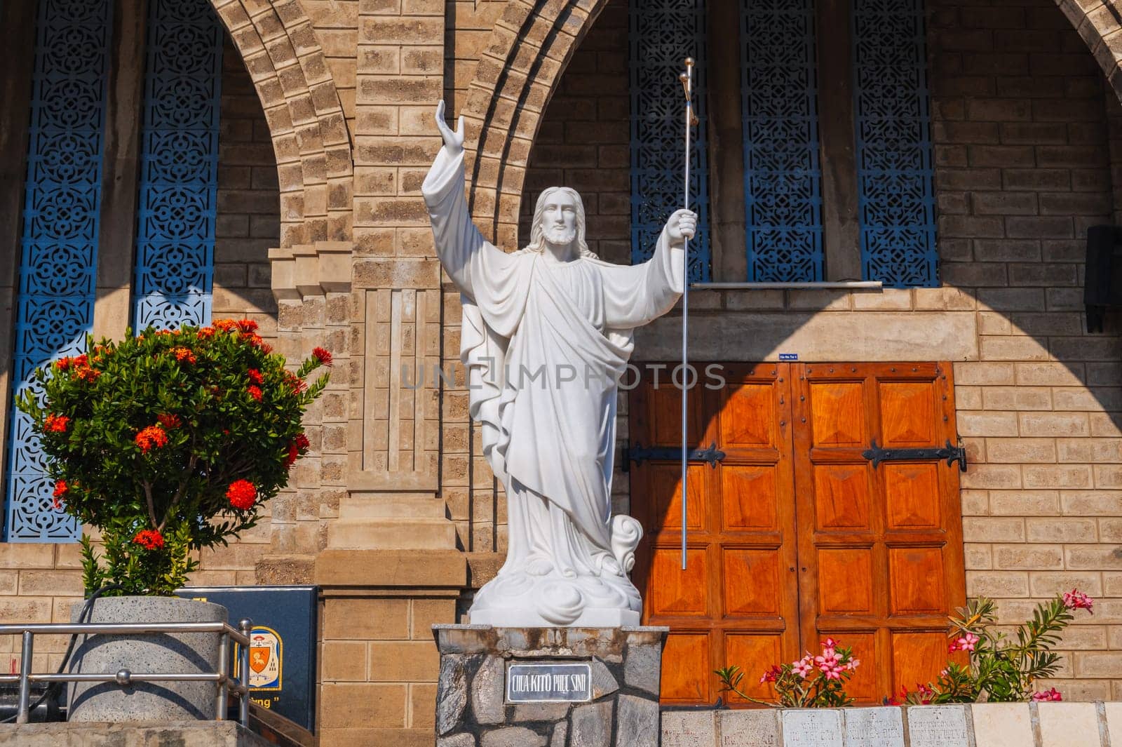 Statue of Jesus Christ in square of Nha Trang Cathedral or Stone Church or Christ the King Cathedral in Asia. Nha Trang, Vietnam - August 22, 2024