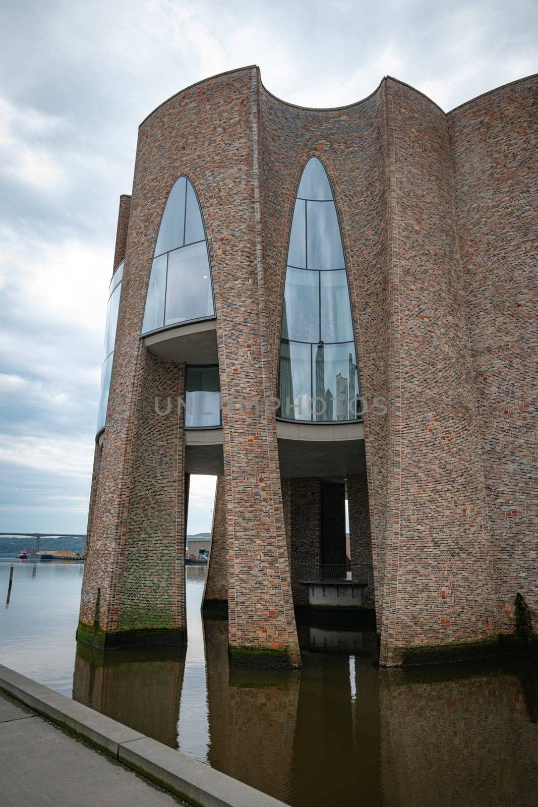 The iconic Fjordenhus between two houses in the harbour basin of Vejle, Denmark,