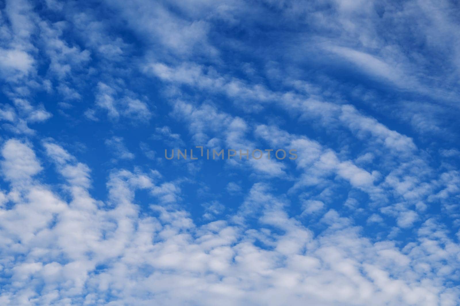 blue sky with white cirrus-cumulus clouds on a winter day