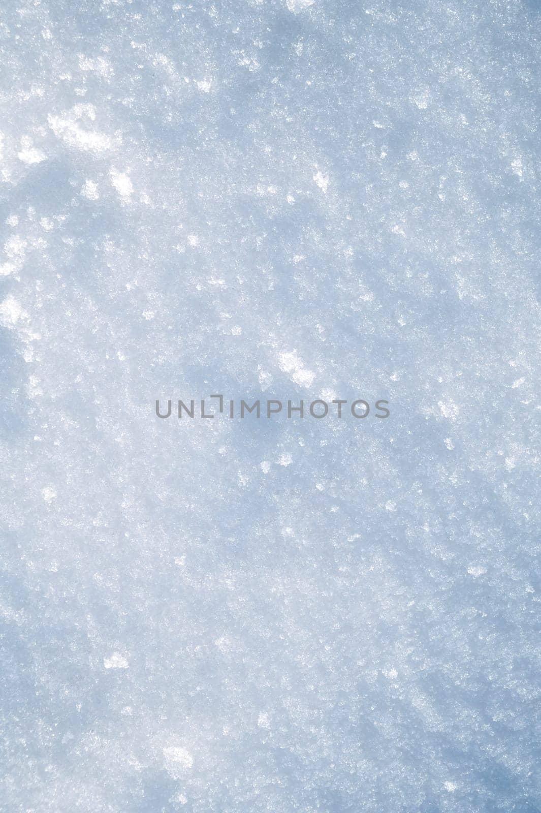 white texture of snow on a snowdrift on a cold winter day