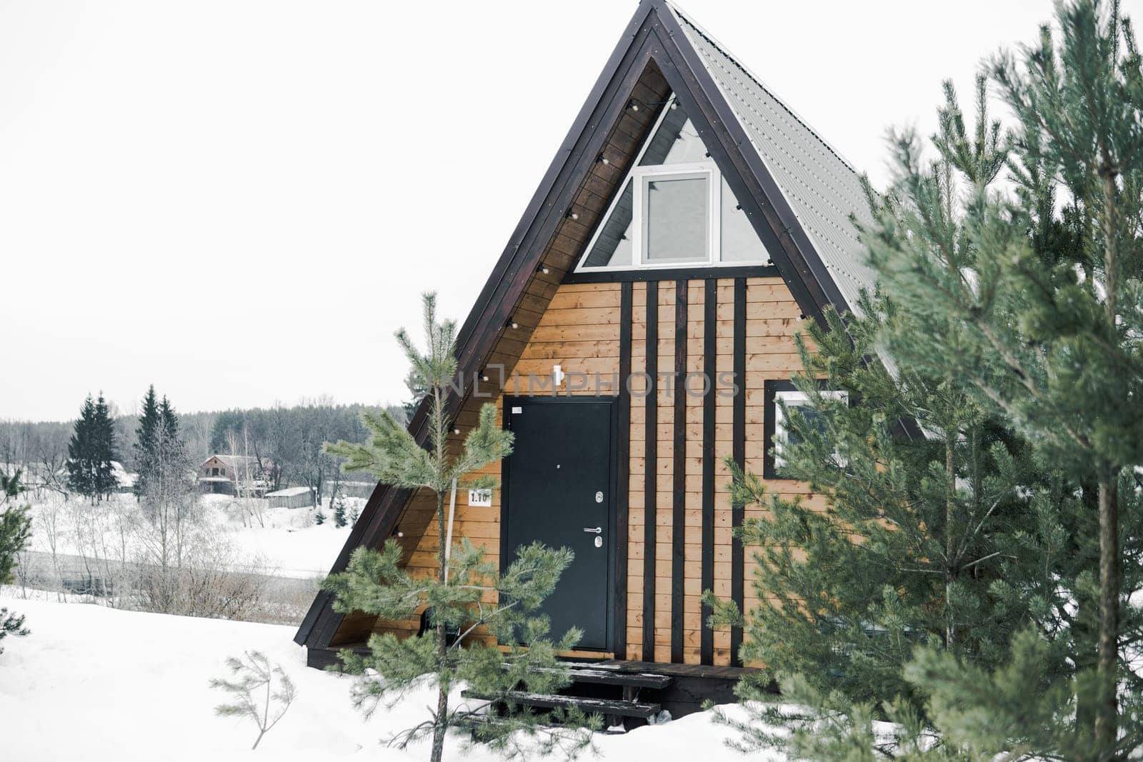 A country house in nature in winter. Rest in an ecologically clean place in winter. Glamping in nature