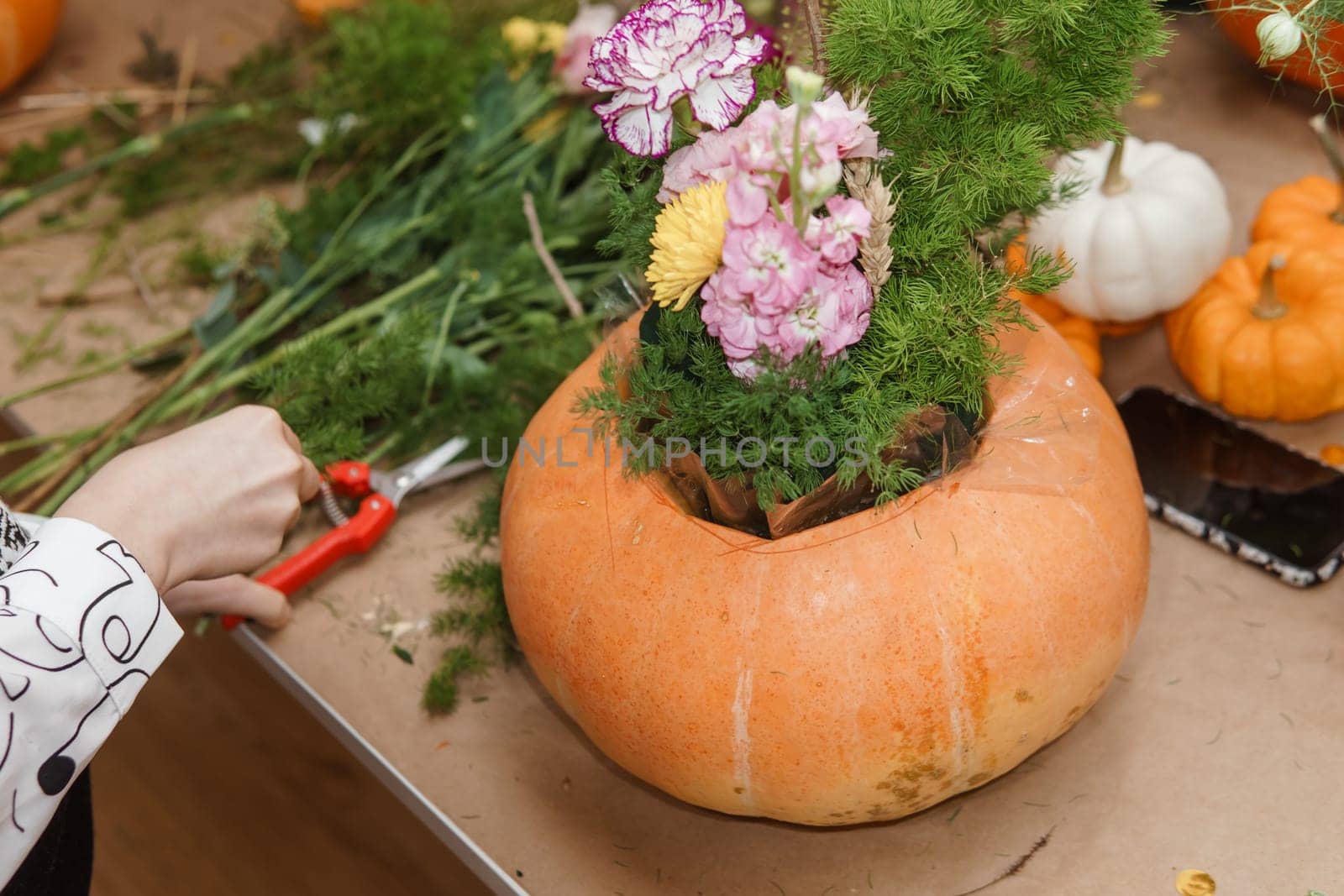 Creating a floral composition in a pumpkin. Making decor with your own hands