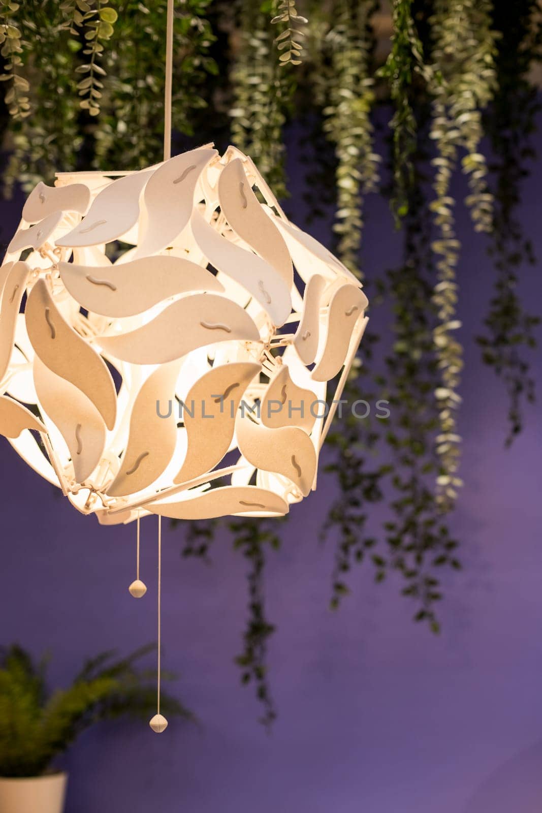 Beautiful geometric modern ceiling lamp interior contemporary decoration isolated on a dark background.