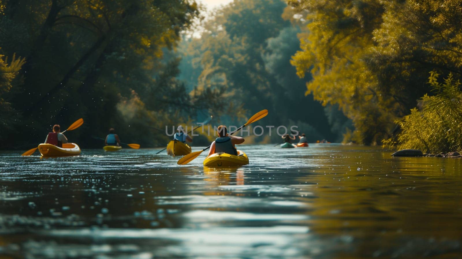 A group of kayakers navigate a serene river, surrounded by vibrant greenery and warm sunlight. The kayakers, equipped with paddles, create gentle ripples on the water's surface as they glide through the tranquil setting. The golden hues of late afternoon enhance the beauty of the landscape, making it a picturesque outdoor adventure.