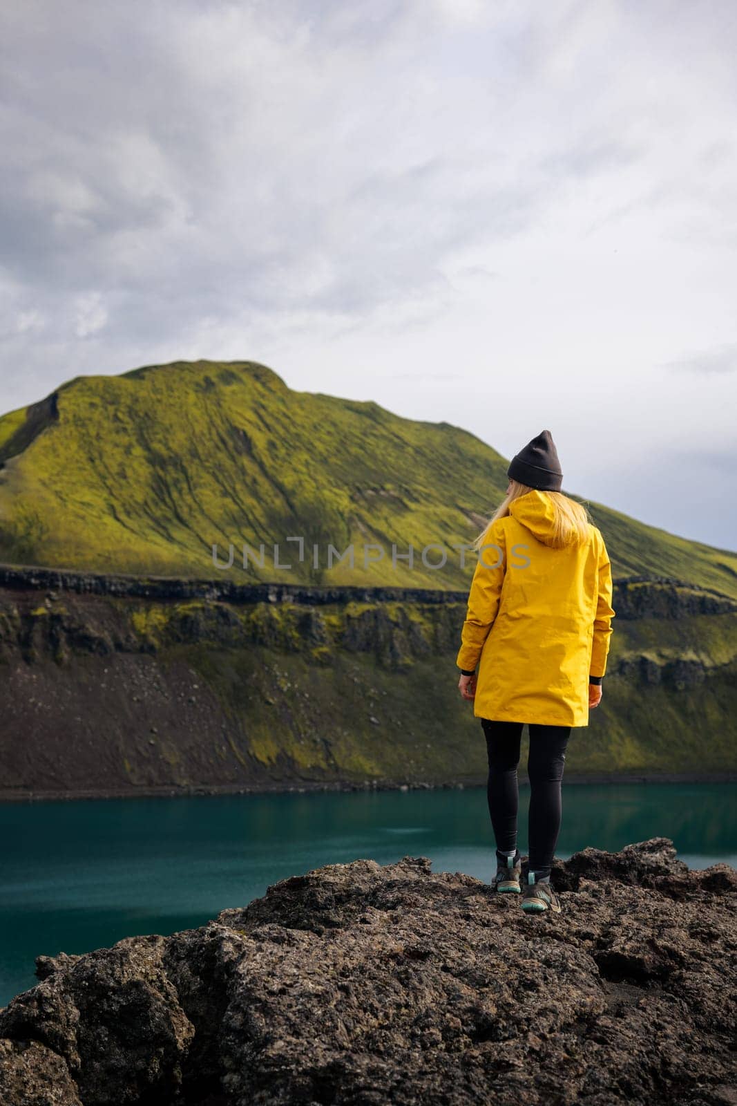 Backpacker girl in Iceland takes a moment to reflect by Kustov