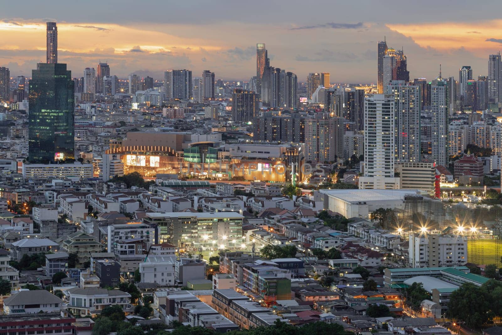 Bangkok, Thailand - 15 Aug 2024 - Bangkok city skyscrapers after sunset with Dramatic sky background before Sunset. View of Beautiful Clouds in the Sky over Large Metropolitan City, Copy space, Selective focus.