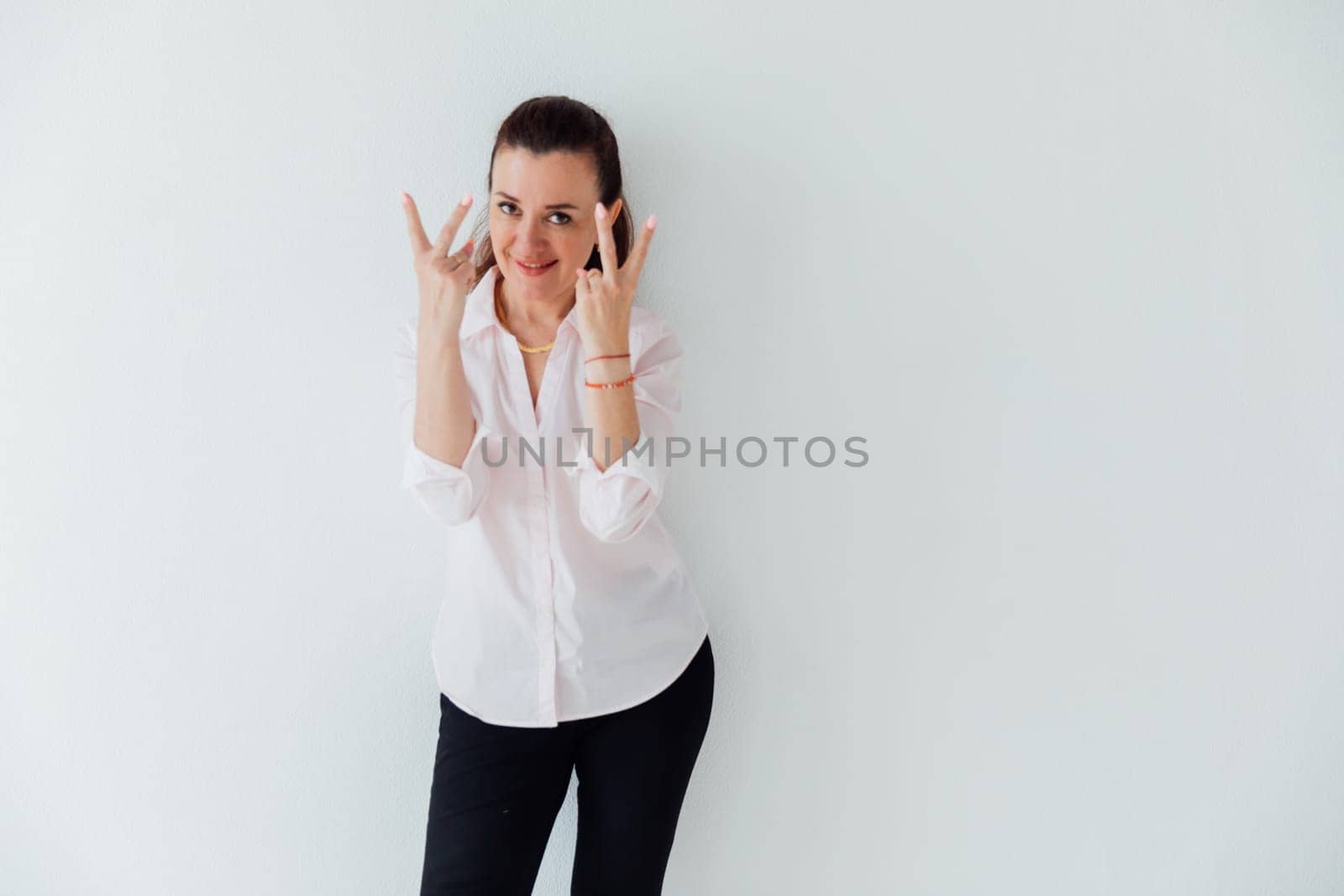 woman showing four fingers on two hands