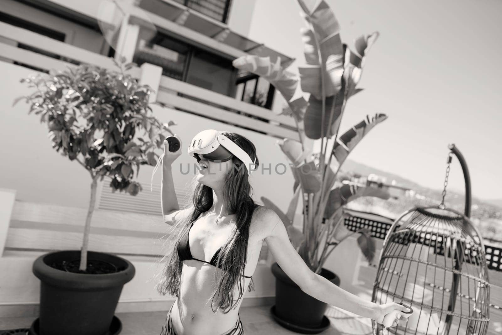 A stylish figure dressed in a fashionable bikini is enjoying rooftop relaxation amid lush greenery and warm sunlight