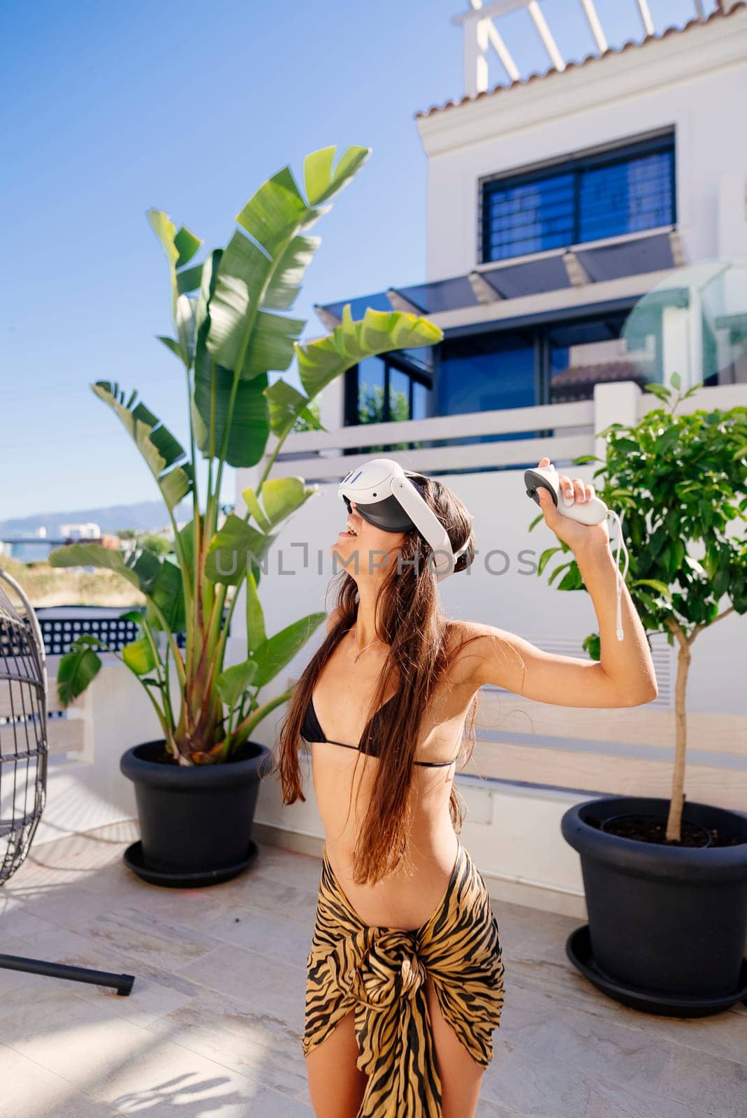 A vibrant summer scene showcases a carefree woman who is truly enjoying the great outdoors in style and grace