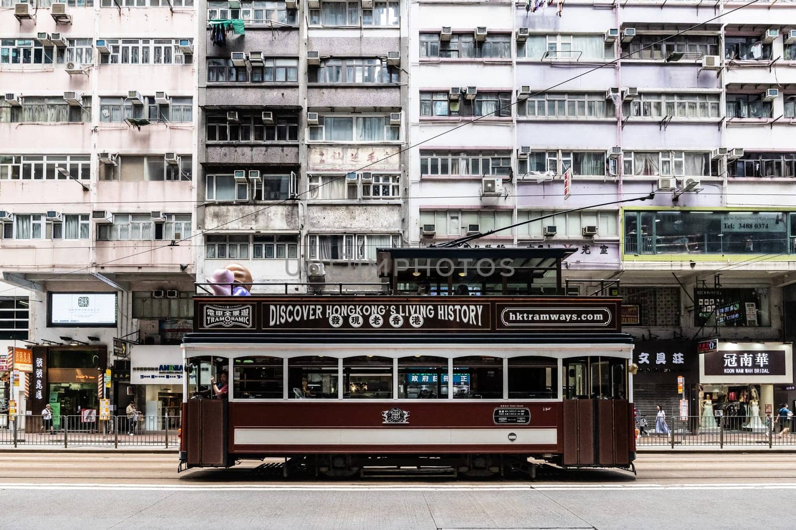HONG KONG, CHINA - SEPTEMBER 29 2024: Streetscape with busy roads and trams in Wan Chai on Hong Kong Island in Hong Kong China
