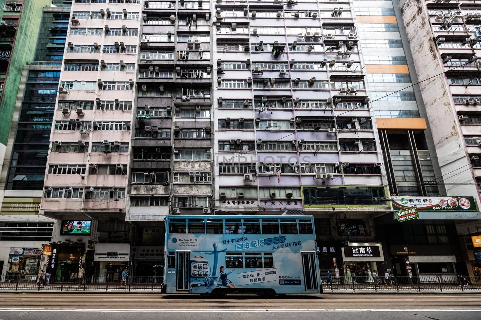 HONG KONG, CHINA - SEPTEMBER 29 2024: Streetscape with busy roads and trams in Wan Chai on Hong Kong Island in Hong Kong China