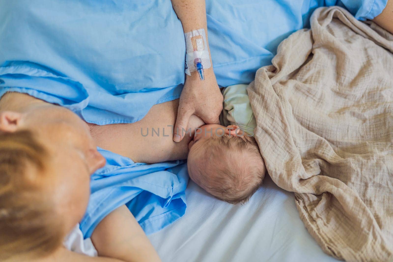 A mom breastfeeds her newborn baby in the hospital. The intimate moment fosters bonding between mother and child, promoting emotional connection and providing essential nourishment for the baby's well-being.