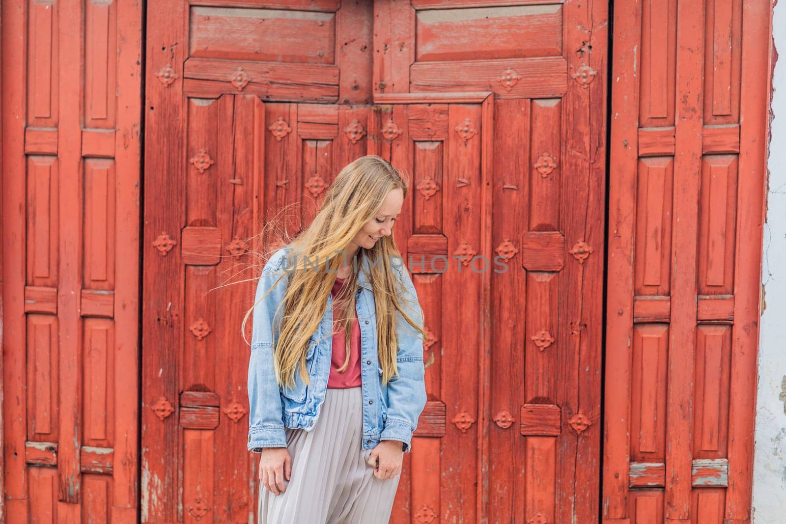 Female tourist in a colonial house in San Cristobal de las Casas, Mexico. Cultural exploration, architecture, and travel experience concept.