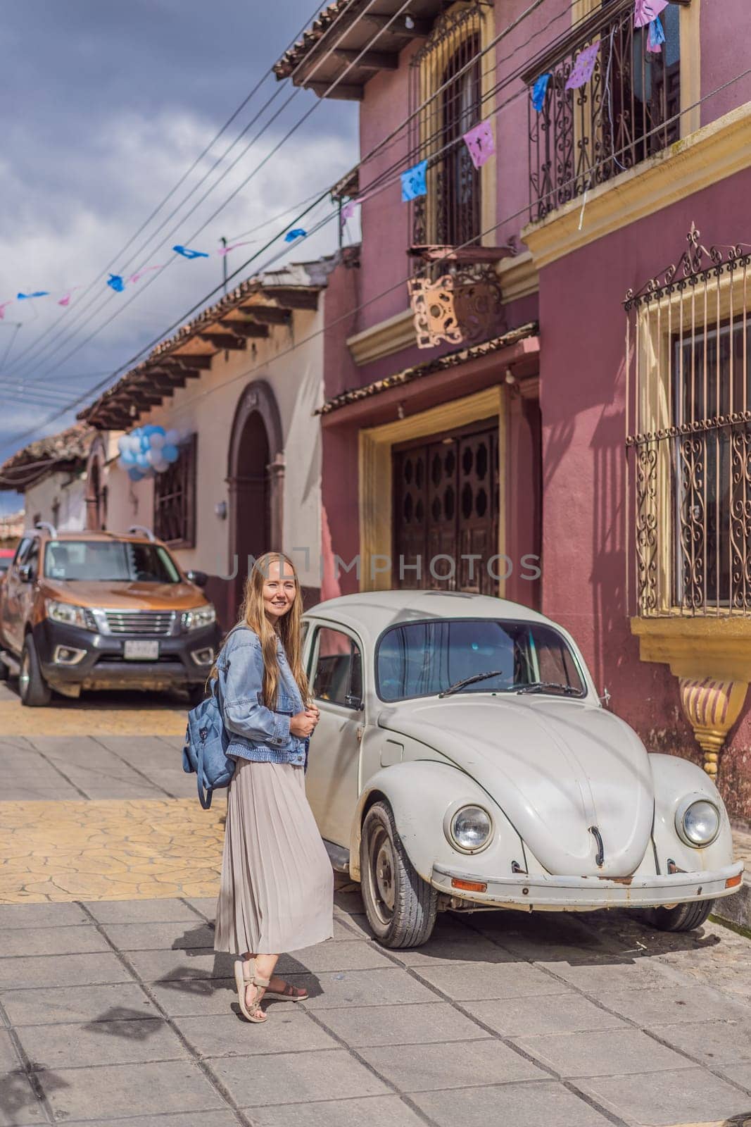 Female tourist walks through the colonial streets San Cristobal de las Casas, Mexico. Cultural exploration, architecture, and travel experience concept.