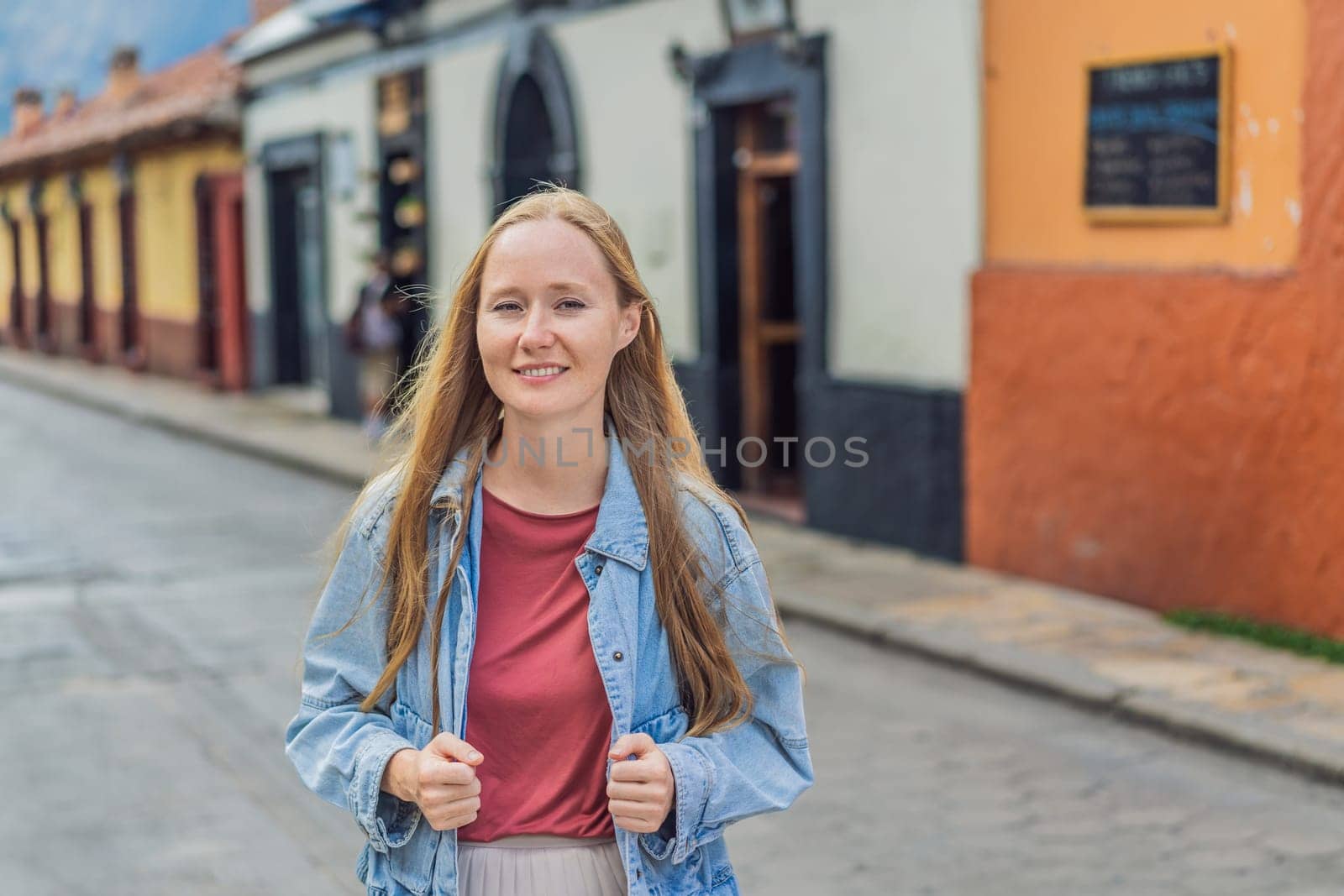 Female tourist walks through the colonial streets San Cristobal de las Casas, Mexico. Cultural exploration, architecture, and travel experience concept.