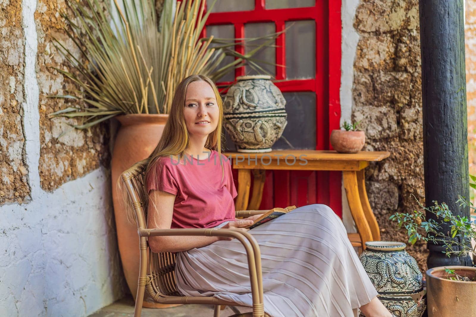 Female tourist in a colonial house in San Cristobal de las Casas, Mexico. Cultural exploration, architecture, and travel experience concept.