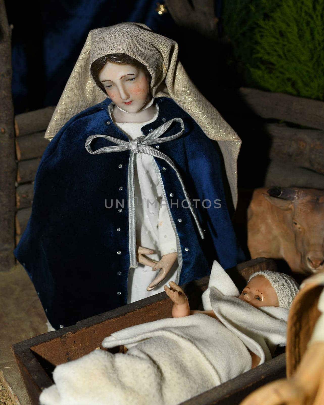 The Virgin Mary looks at the newborn Jesus Christ in cradle