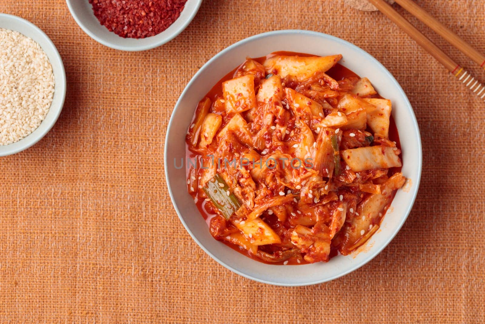 Kimchi, Kimchee in the Bowl, Red Spicy Kim Chi, Hot Fermented Napa Cabbage, Traditional Jimchi, Korean cuisine, top view horizontal banner with a copy space