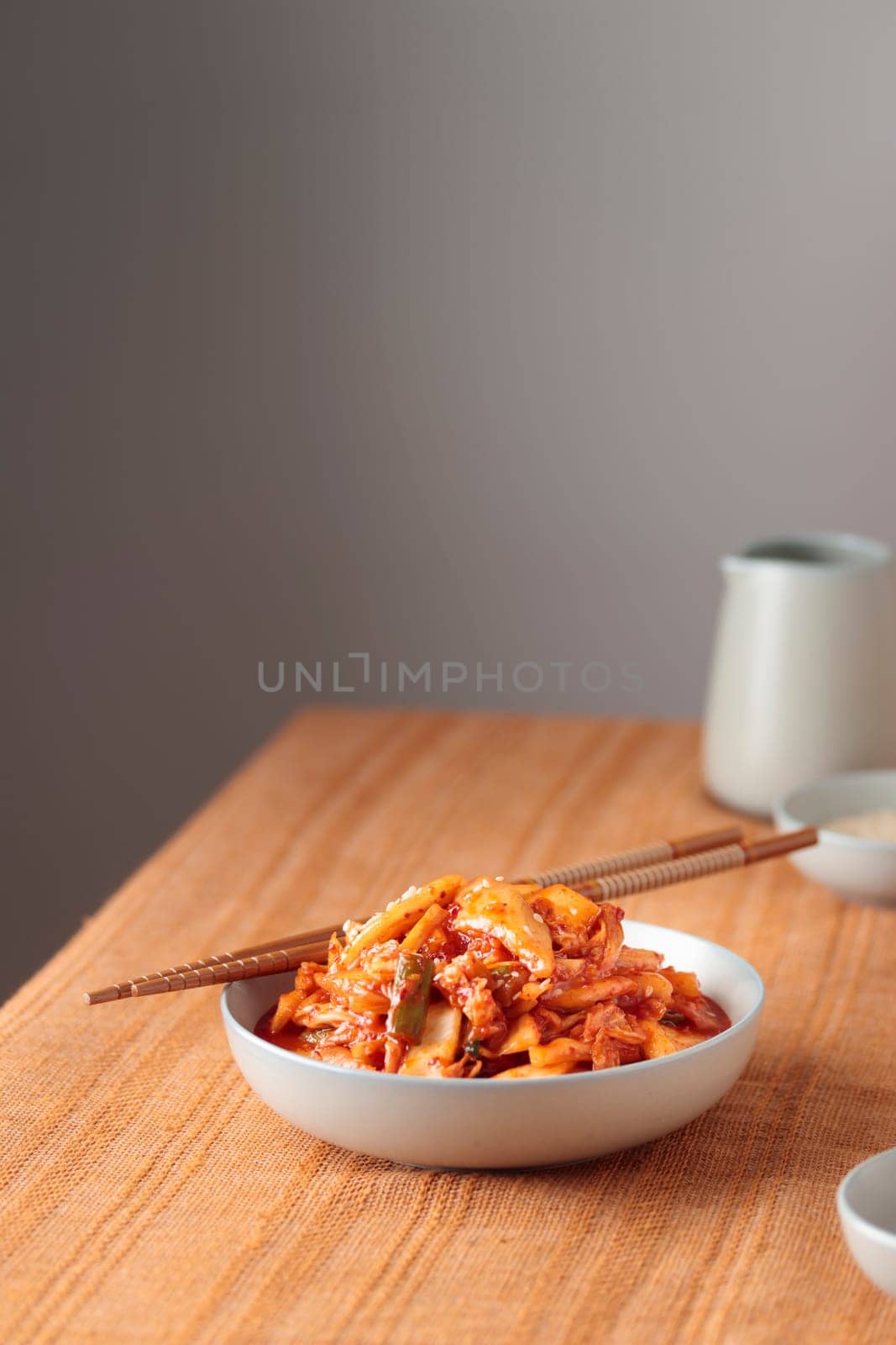 Kimchi, Kimchee in the Bowl, Red Spicy Kim Chi, Hot Fermented Napa Cabbage, Traditional Jimchi, Korean cuisine, banner with a copy space