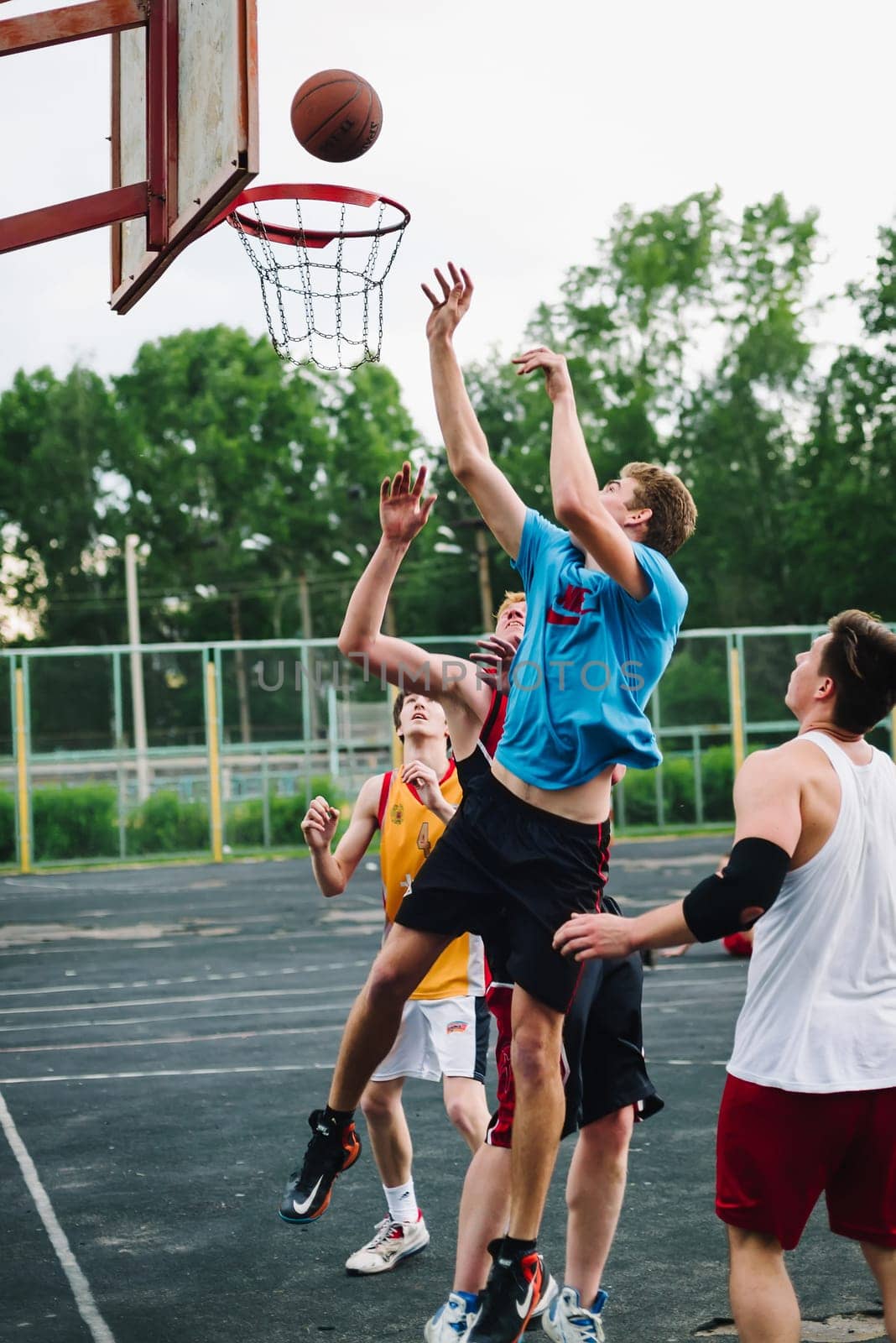 VICHUGA, RUSSIA - JUNE 11, 2016: Teenagers playing streetball on the celebration of the city of Vichuga, Russia