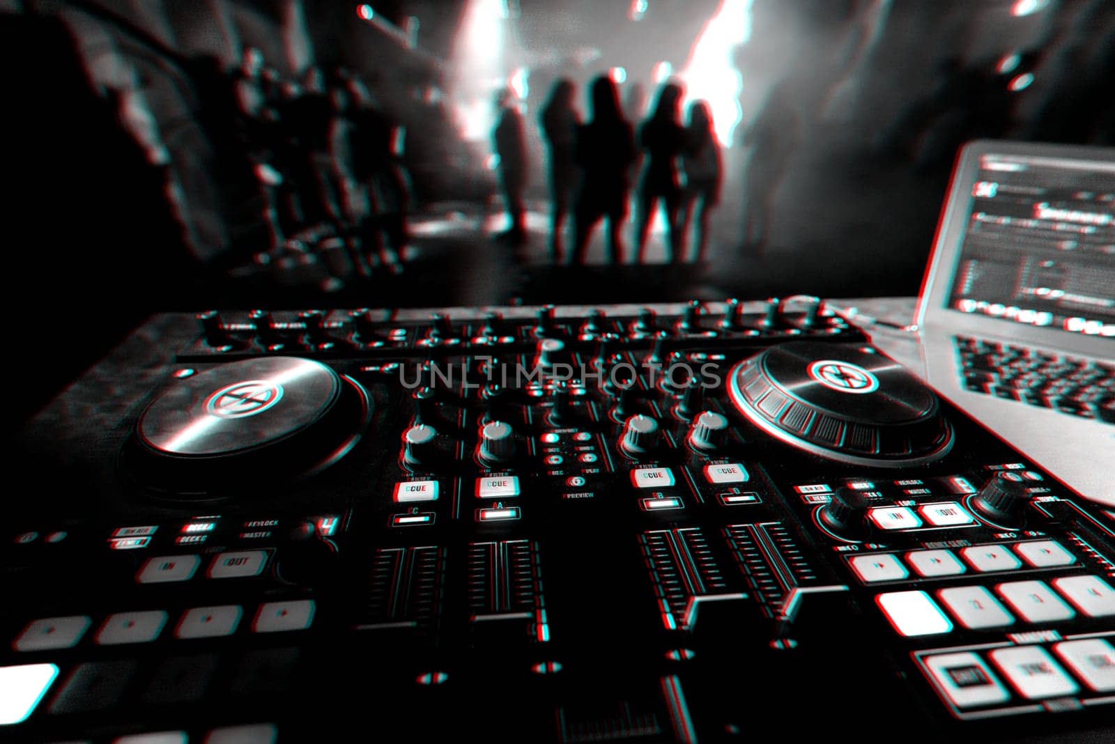DJ mixer controller Board for professional mixing of electronic music in a nightclub at a party with dancing people in the background. Black and white photo with glitch effect and small grain