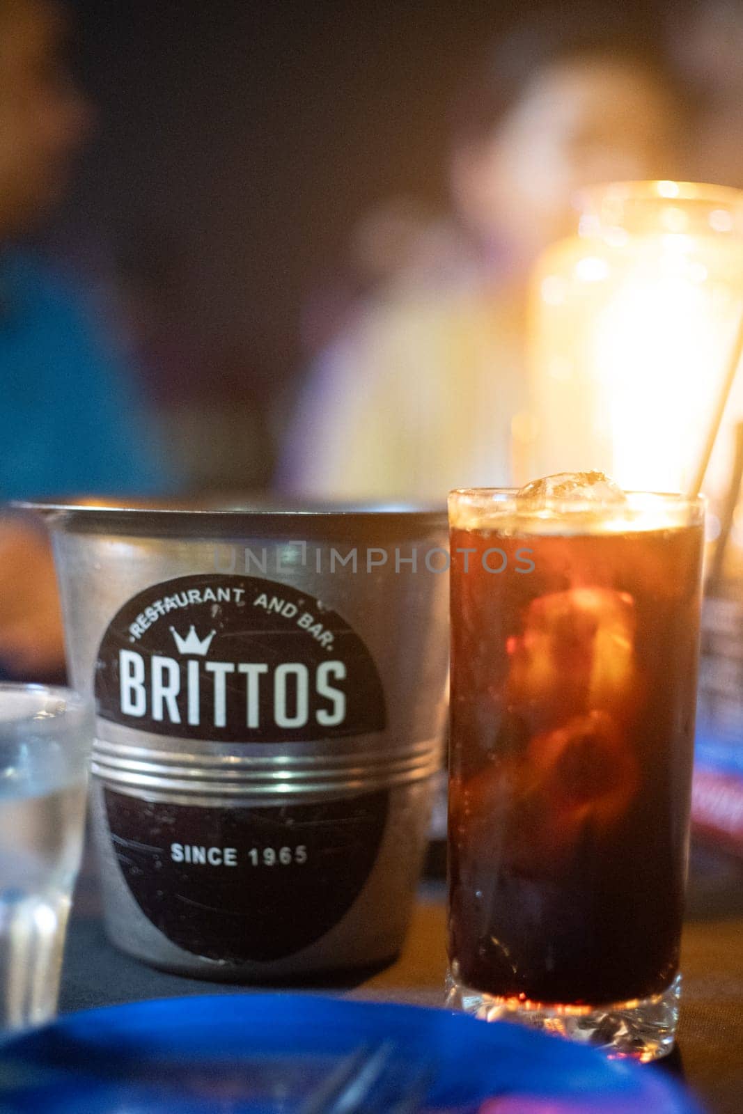 Goa, India - 16th Aug 2024: Macro shot showing ice bucket of famous bar shack Brittos on Baga beach a popular spot for drinks, seafood, food, music, karaoke and more