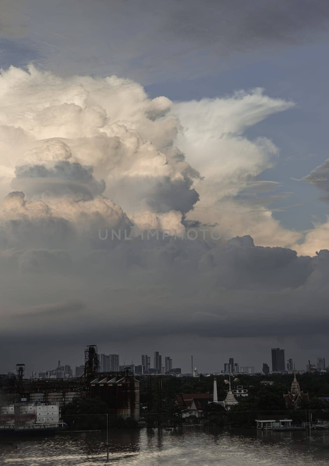Bangkok, Thailand - 04 Oct, 2024 - Amazing Clouds and Sky over view of Bang kachao with the Chao Phraya River before sunset. use it as your wallpaper, poster and Space for text, Selective focus.