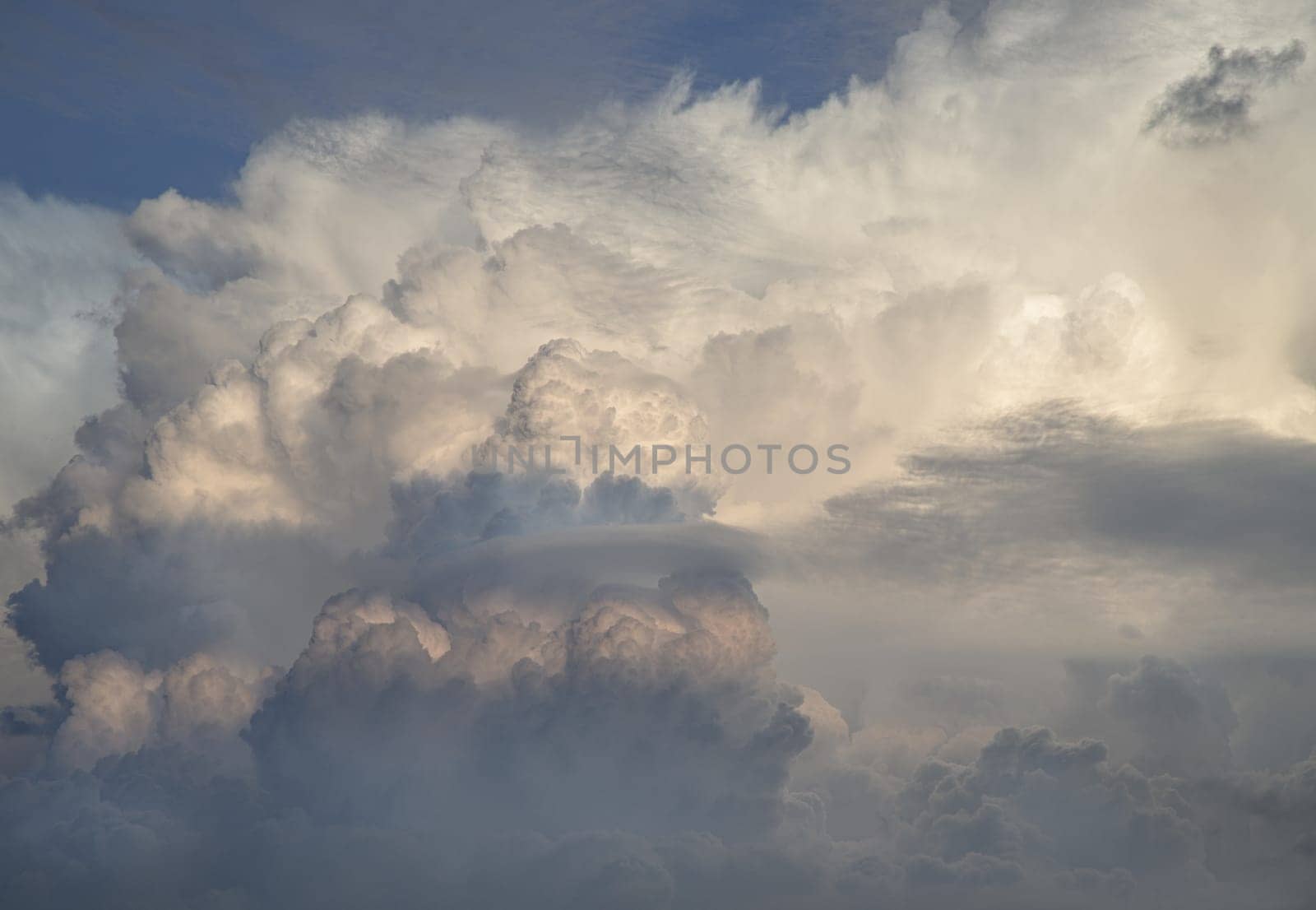 Dramatic clouds with blue sky background before sunset. The softness of the clouds and the brightness of the sky. Concept idea of Imaginative clouds and sky, Nature abstract composition, use it as your Wallpaper, Poster and Space for text, Selective focus.