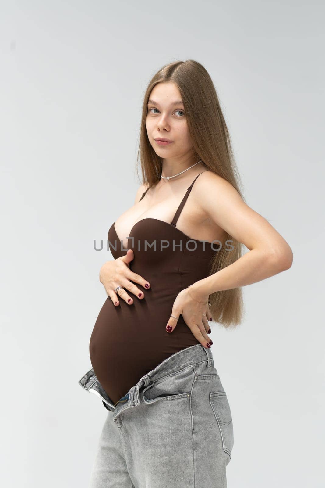 happy girl pregnancy maternity background mother expectant female positive motherhood tummy jeans