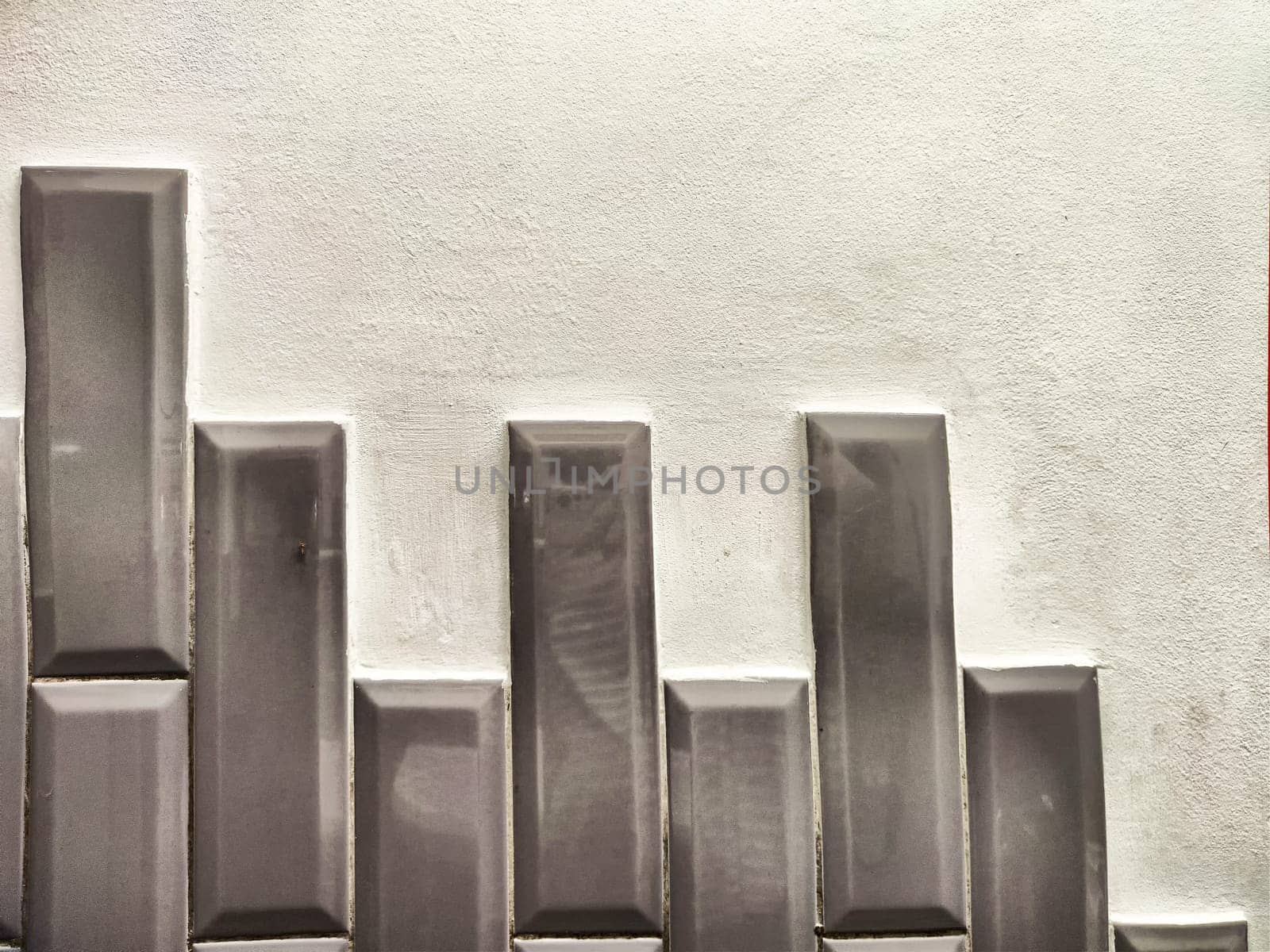 A contemporary wall showcases vertical patterns with smooth texture, providing space for text or design elements