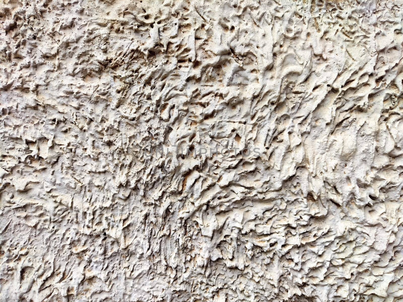 A textured background featuring intricate patterns in light neutral shades, suitable for design and text overlay.