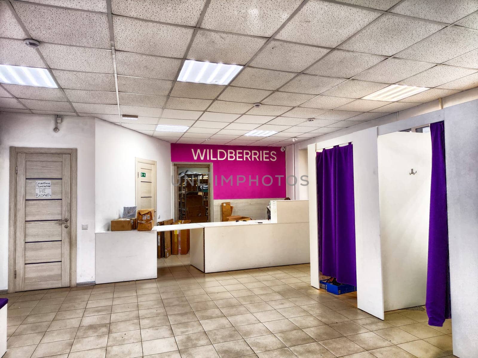 Kirov, Russia - September 11, 2024: The interior of a retail space displays a marketplace logo with service counters and fitting rooms in vibrant colors, typical of stores in Russia.
