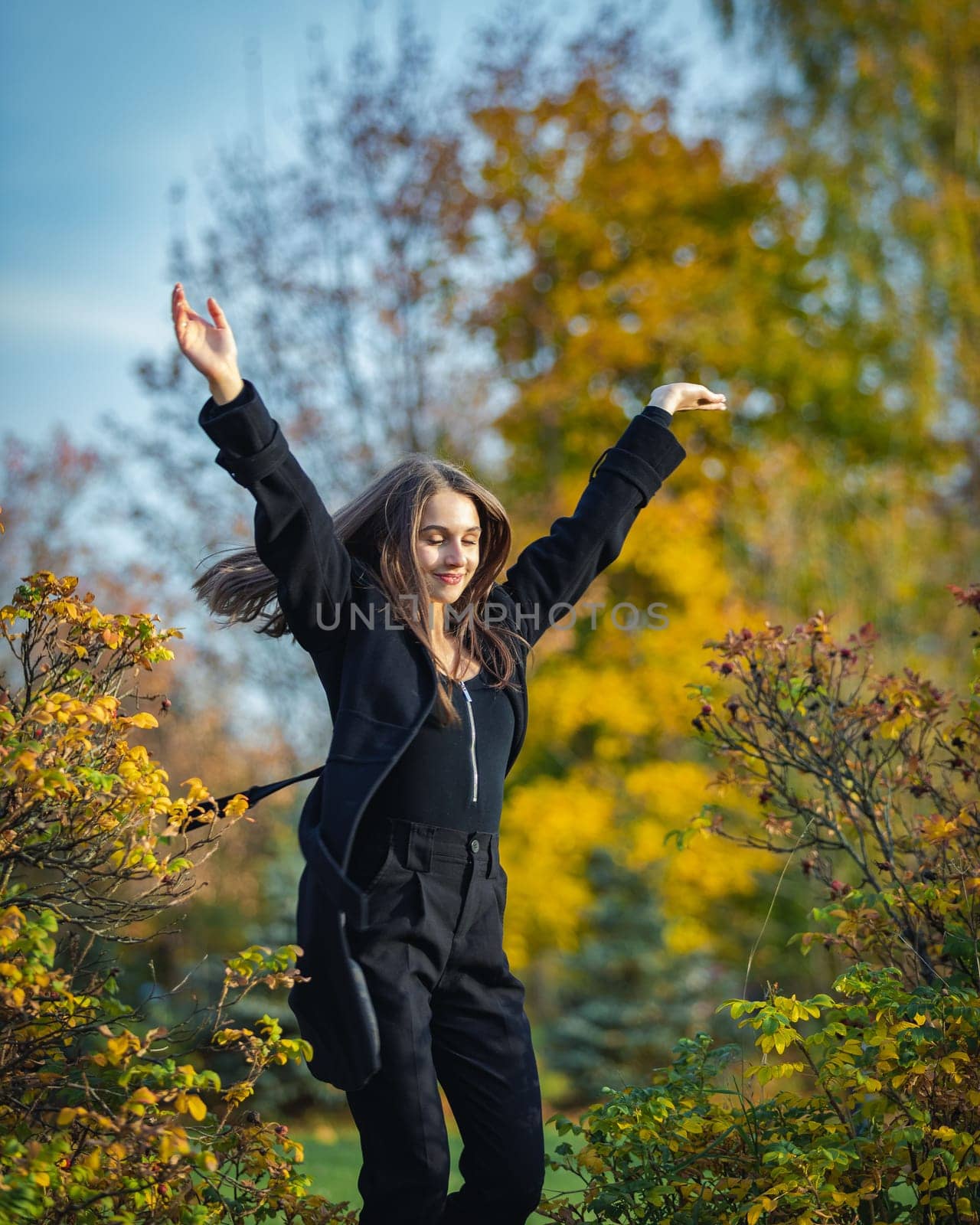 Happy girl spinning in the autumn park. by Yurich32