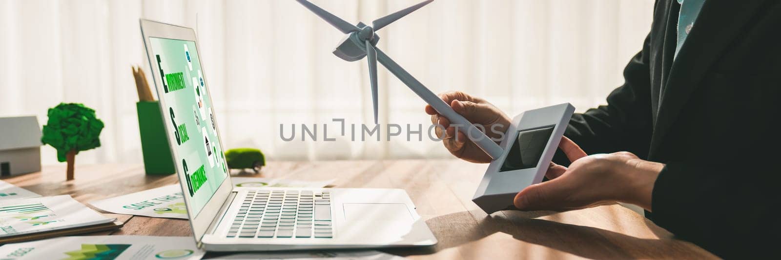 ESG environmental social governance display on laptop on eco-friendly company with businessman planning on environmental protection initiative for clean and sustainable future ecology. Trailblazing