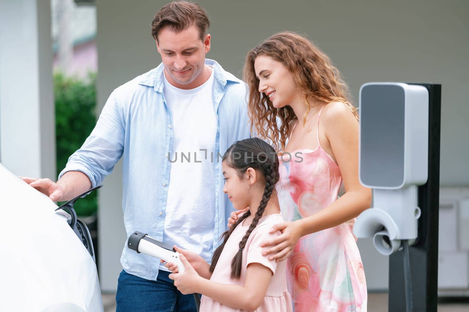 Electric vehicle and modern family at home concept. Synchronos by biancoblue