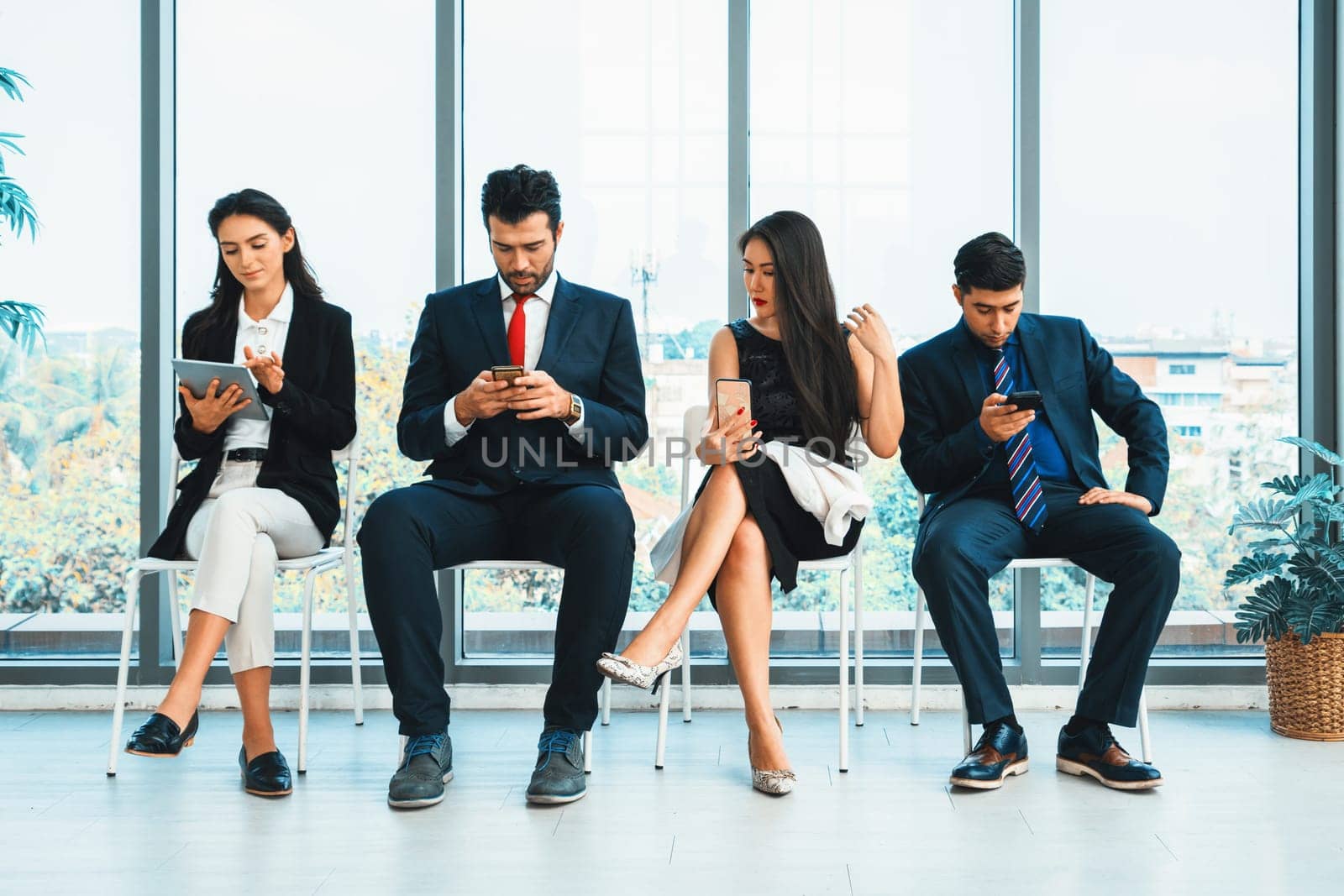 Job seekers and applicants waiting for interview on chairs in office. Job application and recruitment interview qualification concept. Jivy