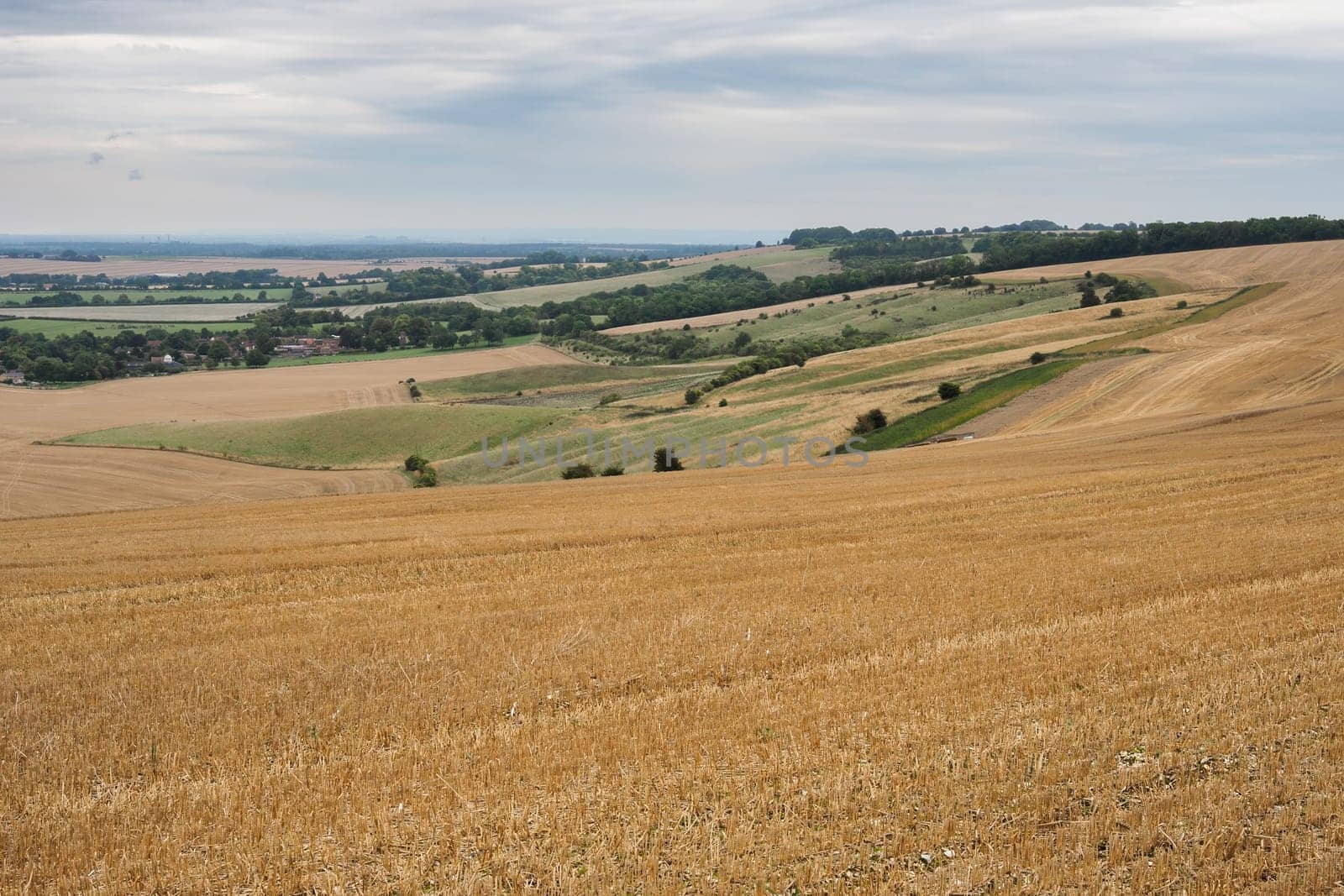 Looking from the Ridgeway over Round Hill with Letcombe Bassett in the distance, Vale of White Horse, Oxfordshire, UK