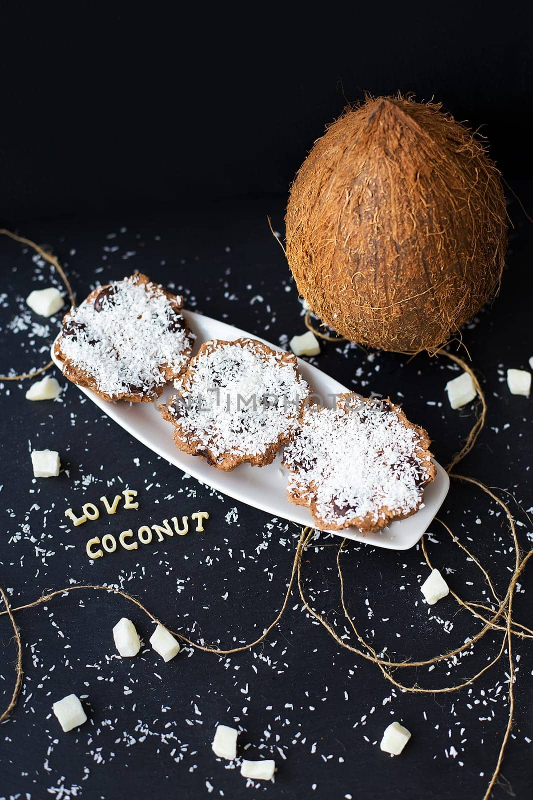 coconut muffins on a black background with words like candied fruits and coconuts