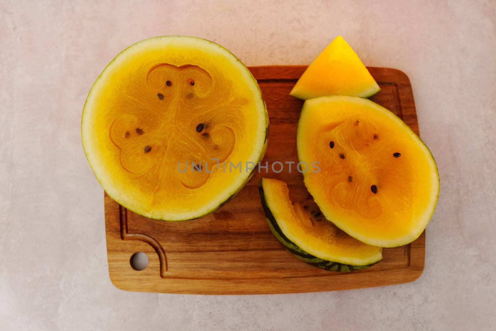 Delicious yellow watermelon sliced open to reveal its vibrant, sweet interior, perfect for summer