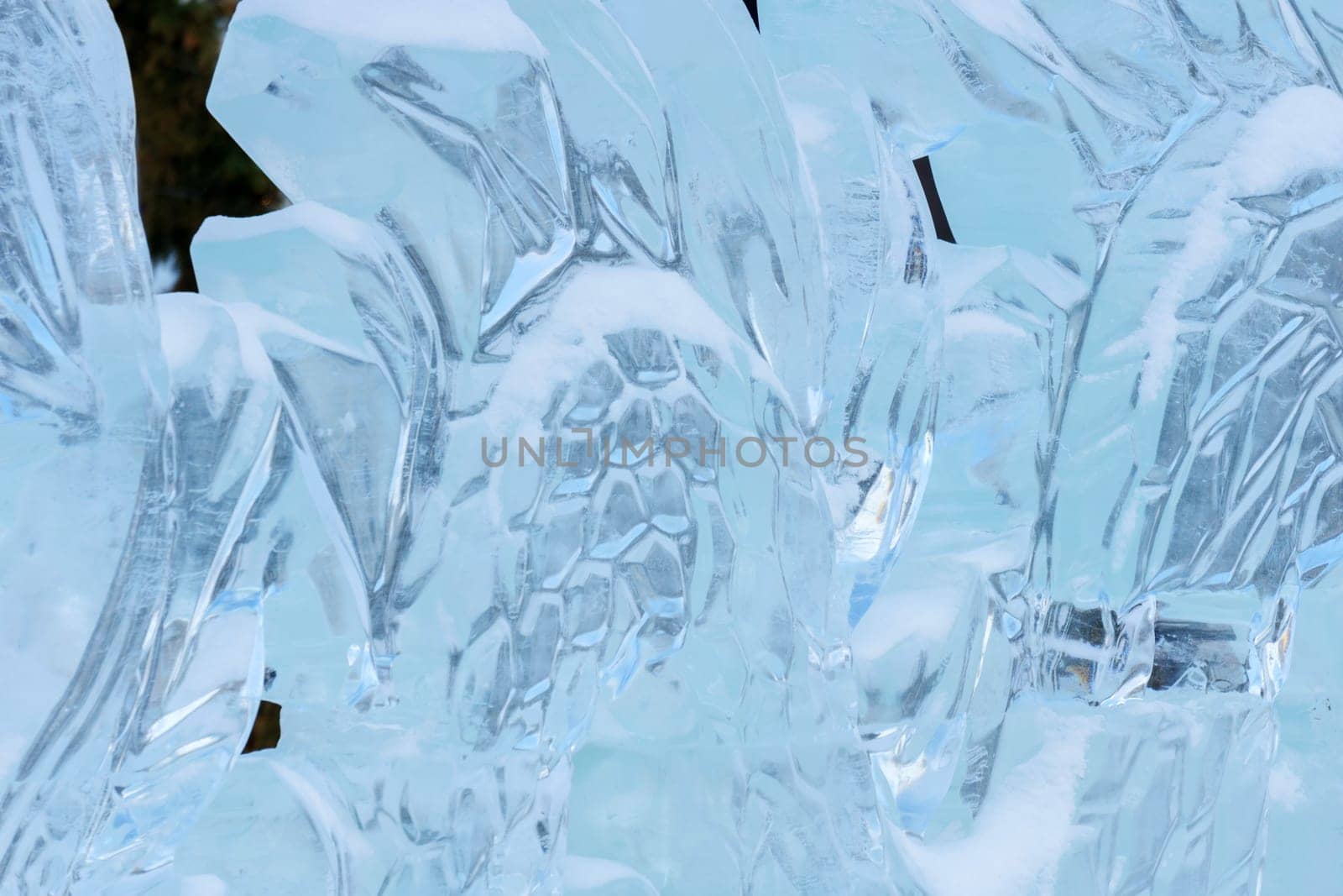 Snow sculpture, frozen in a dynamic and action-packed pose.