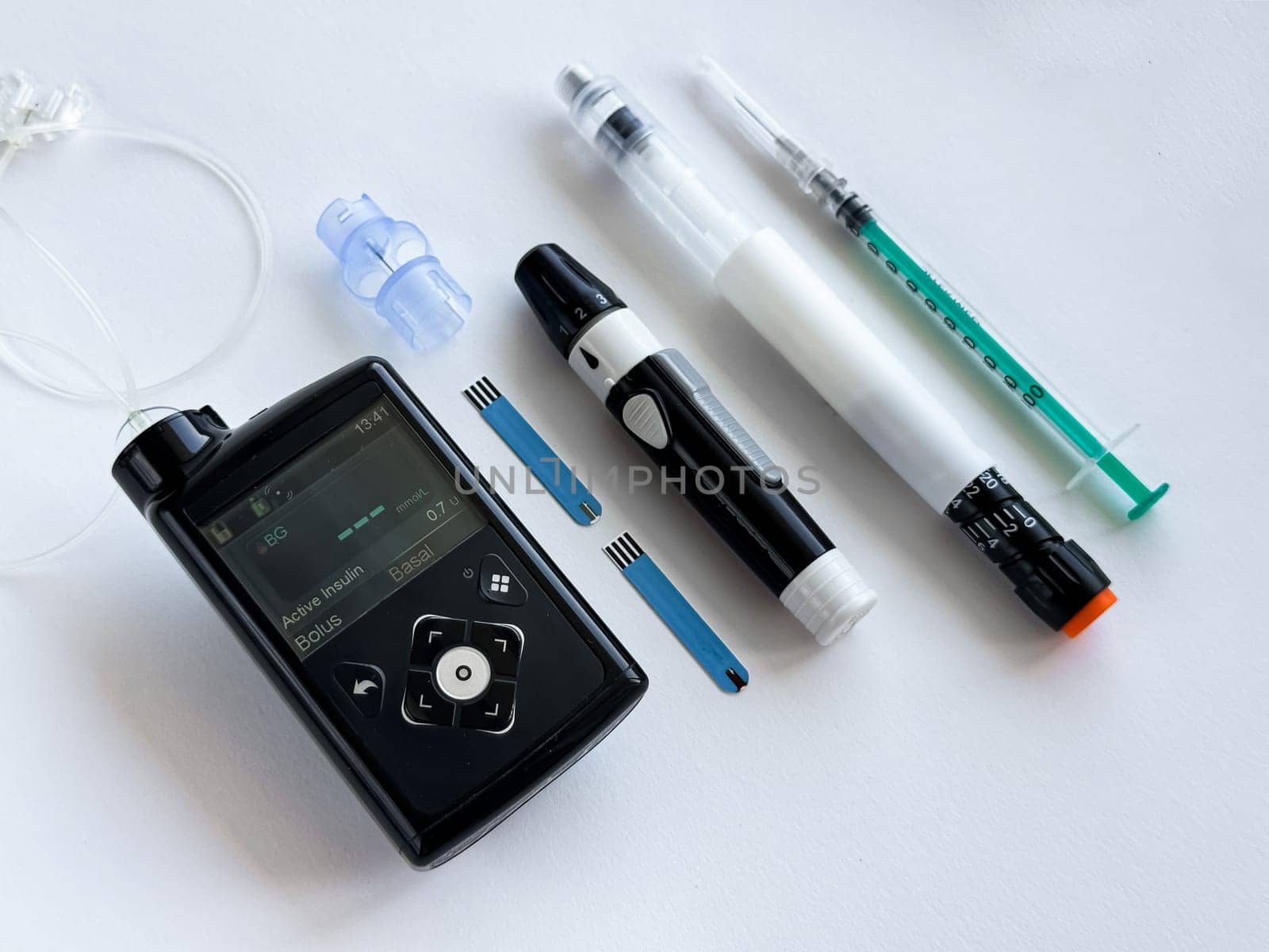 Diabetes management tools, insulin pump, pen, and syringe essentials.
