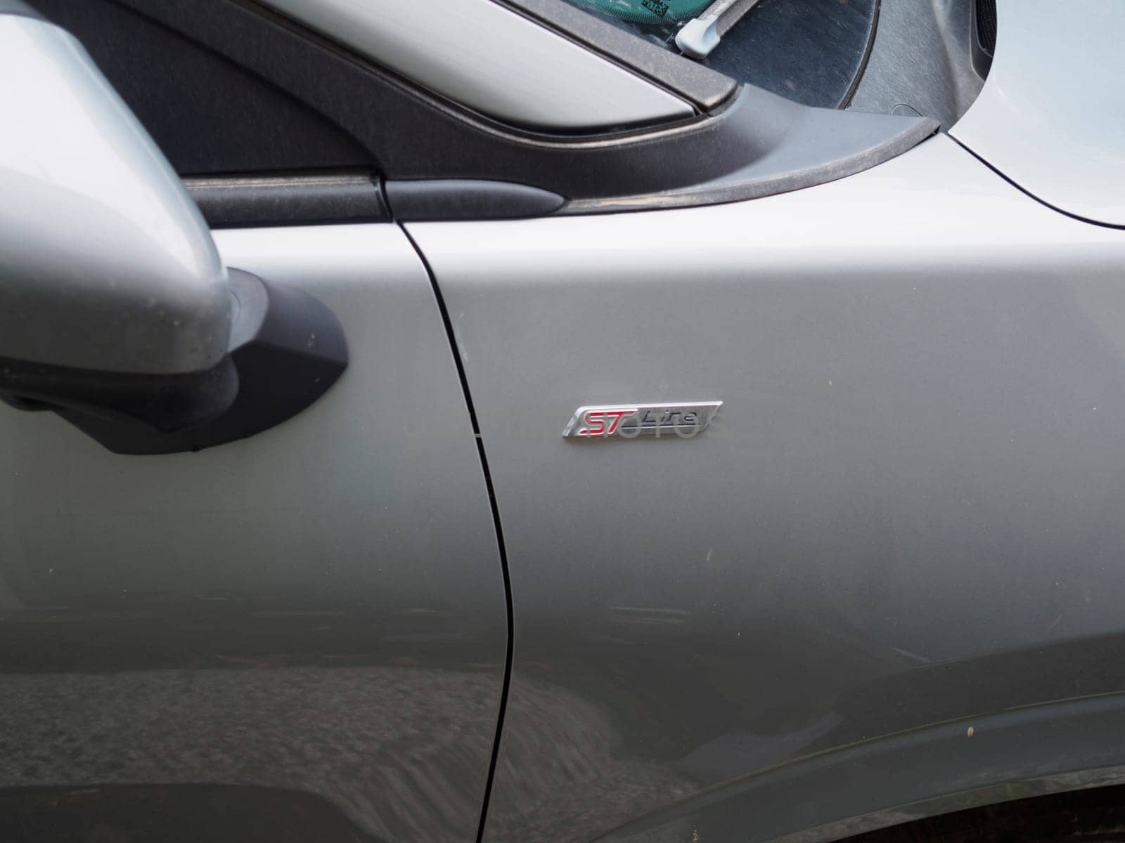 Cremona, Italy September 26th 2024 The ford st line badge shines on a sleek grey car, highlighting the sporty trim package