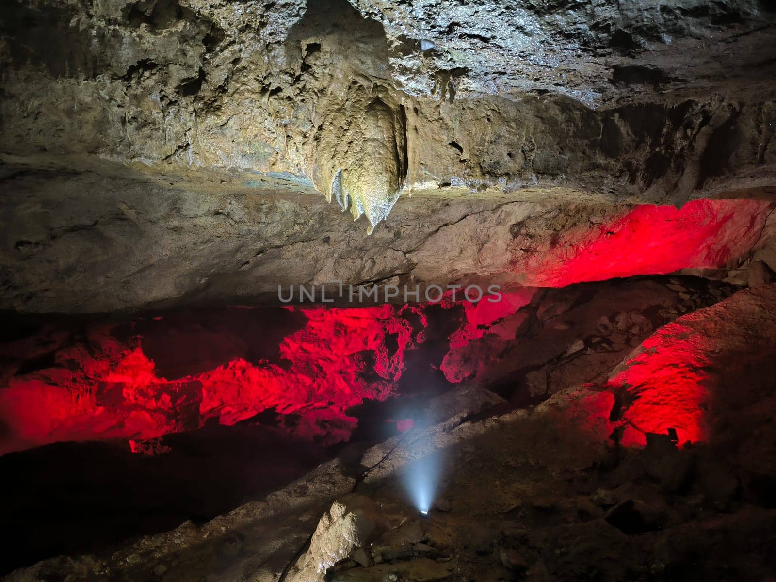 Prometheus Cave, Georgia, tools inside Kumistavi cave,nature park unique reserve, tourism, red light earth stalactites stalagmites dark closed place space tourist center object travel near Tskaltubo