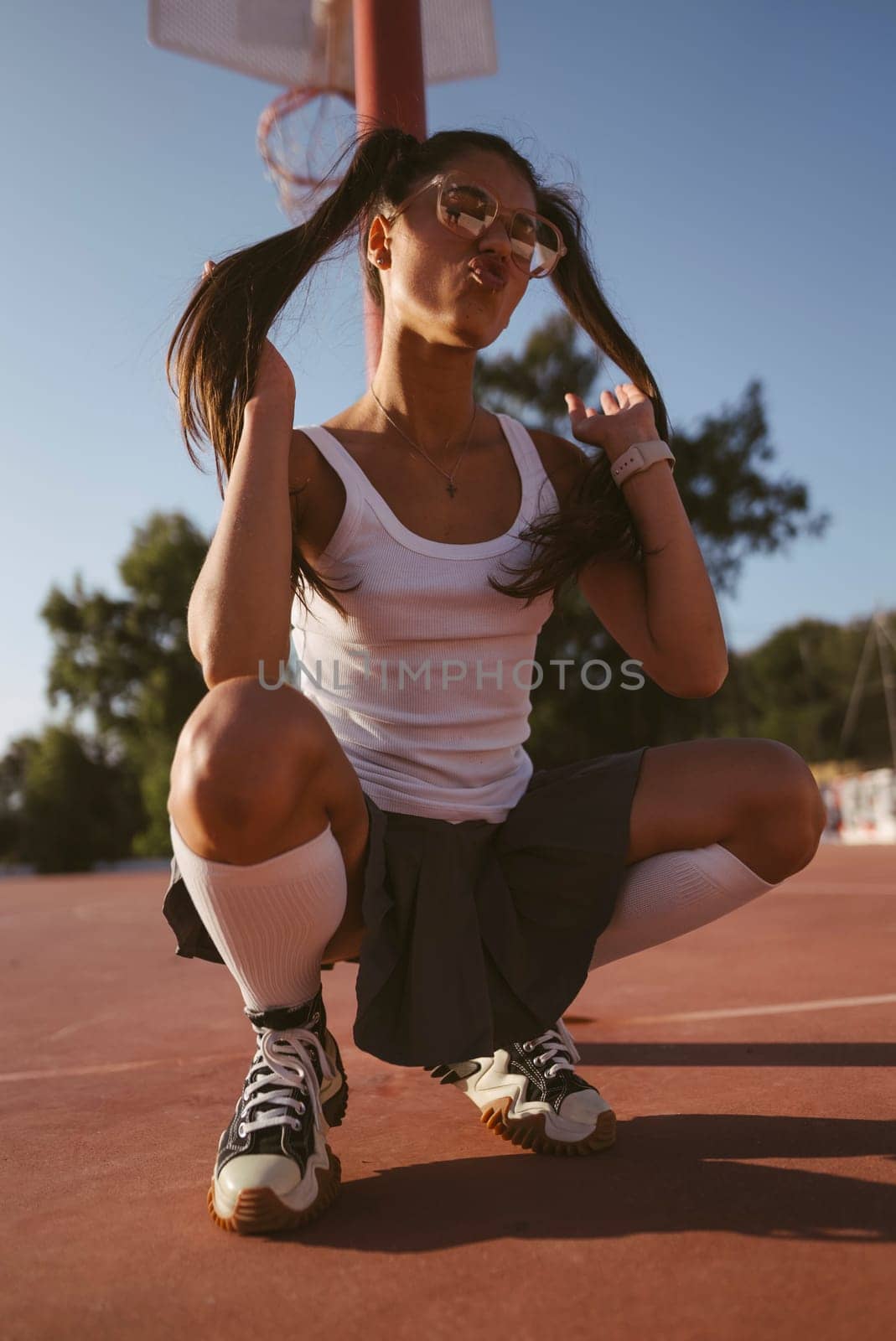 A vibrant and stylish moment beautifully captured on the basketball court, showcasing both youth and boundless energy