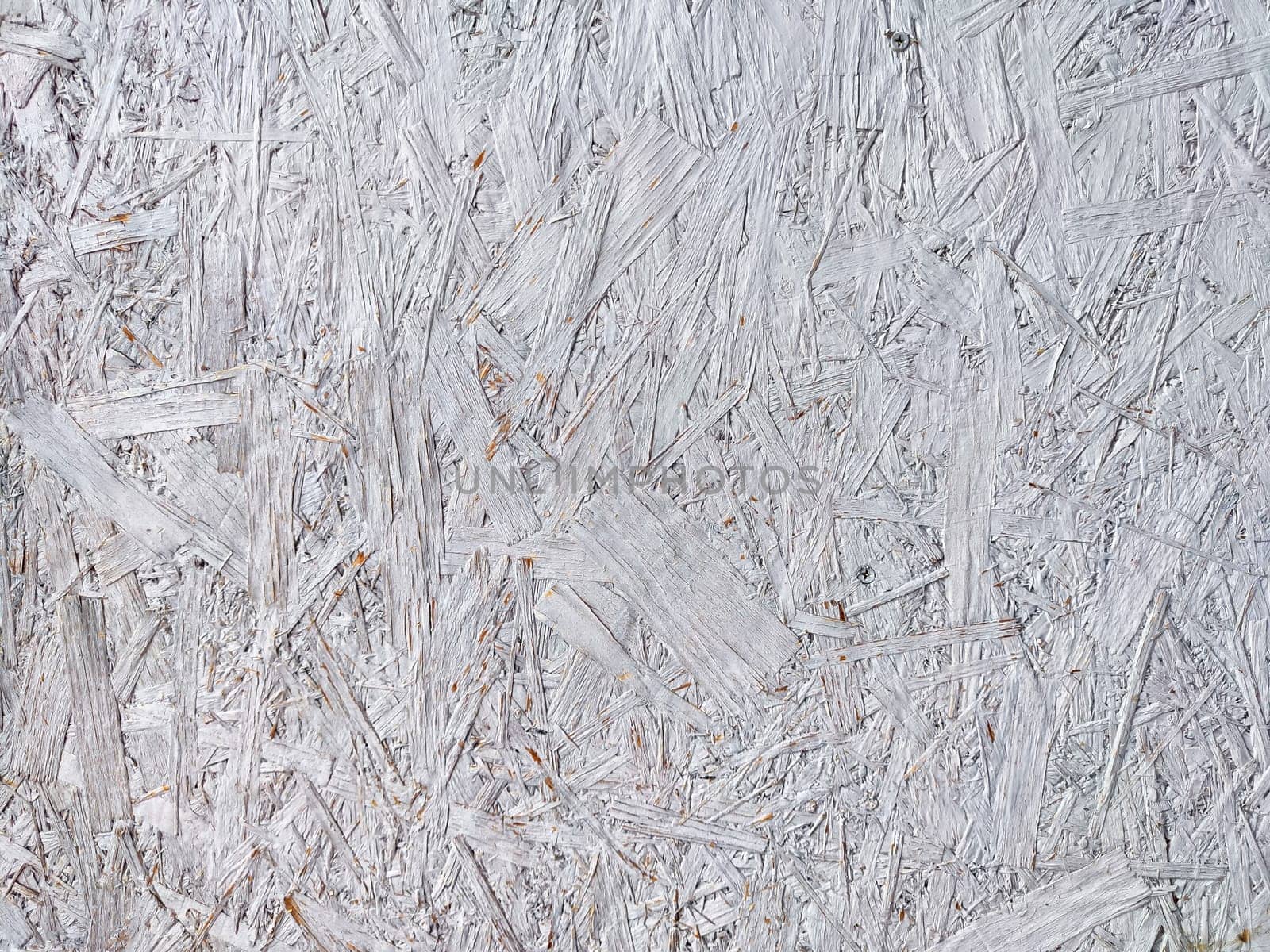 This textured background features a detailed arrangement of light grey wood fibers, perfect for creative projects and design work.