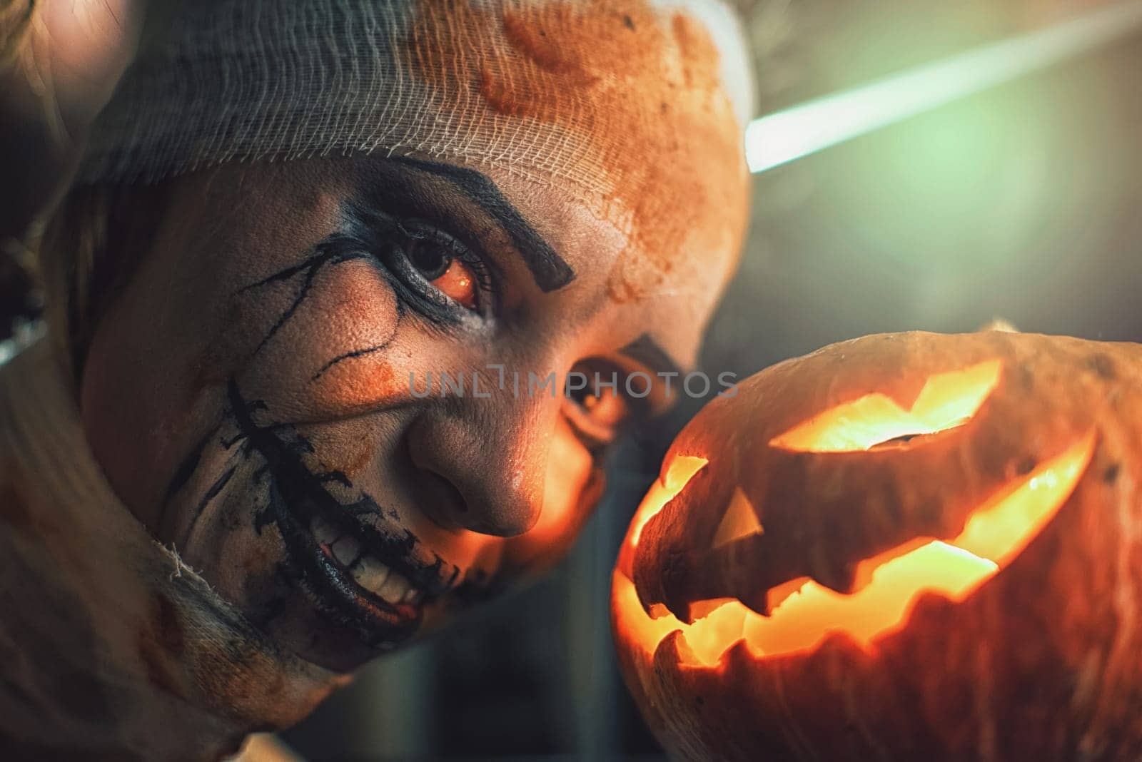 Horrible woman with scary mouth and eyes and pumpkin. Halloween holiday concept