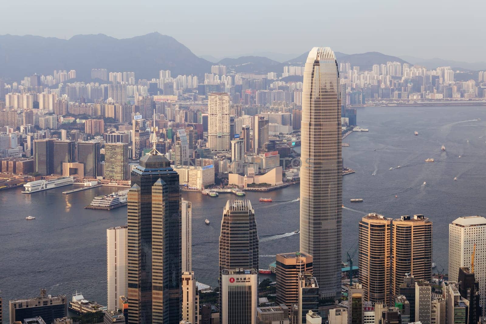 HONG KONG, CHINA - SEPTEMBER 29, 2024: Iconic view around sunset from Lugard Rd Lookout which overlooks Hong Kong Island and Kowloon in Hong Kong, China