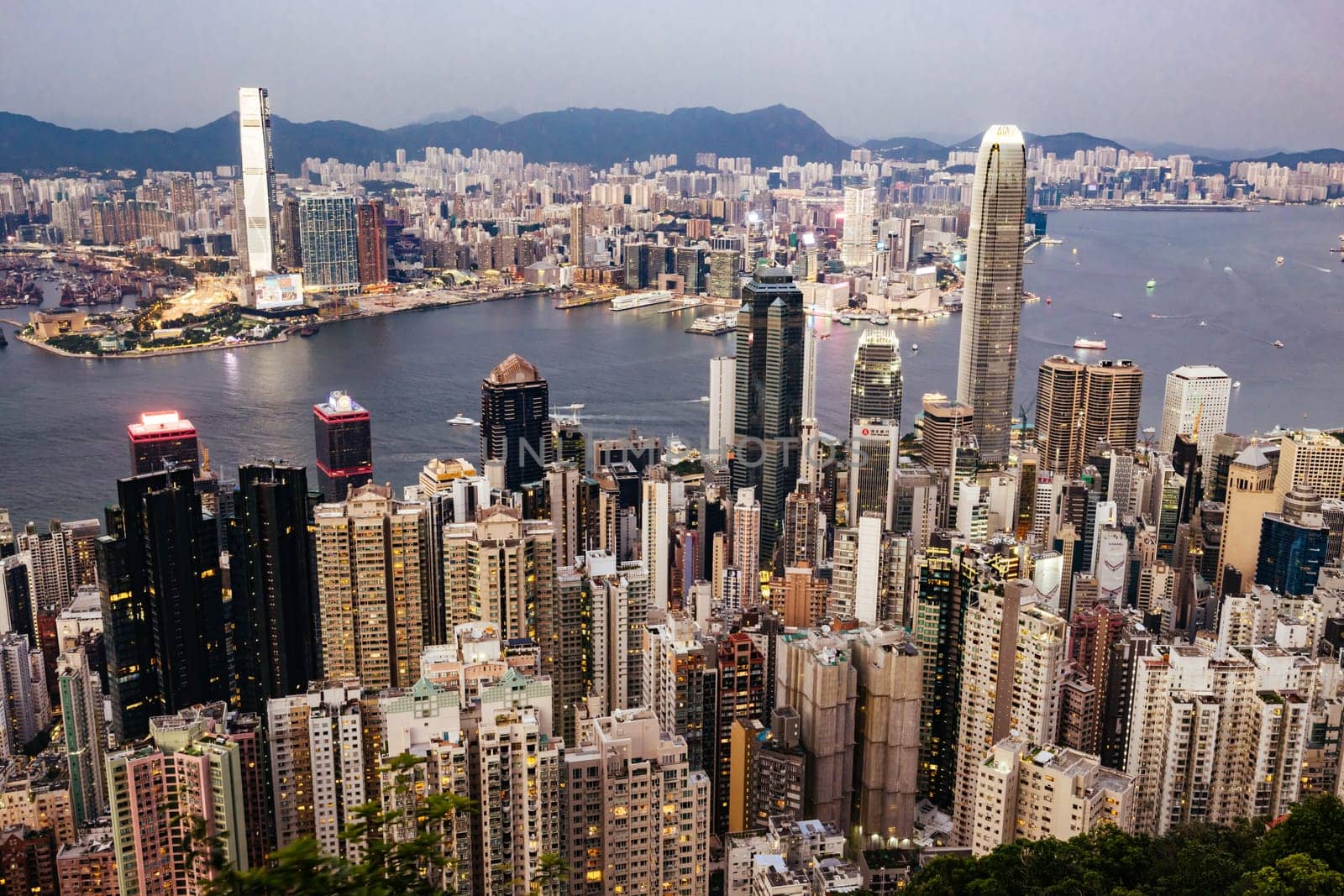 HONG KONG, CHINA - SEPTEMBER 29, 2024: Iconic view around sunset from Lugard Rd Lookout which overlooks Hong Kong Island and Kowloon in Hong Kong, China