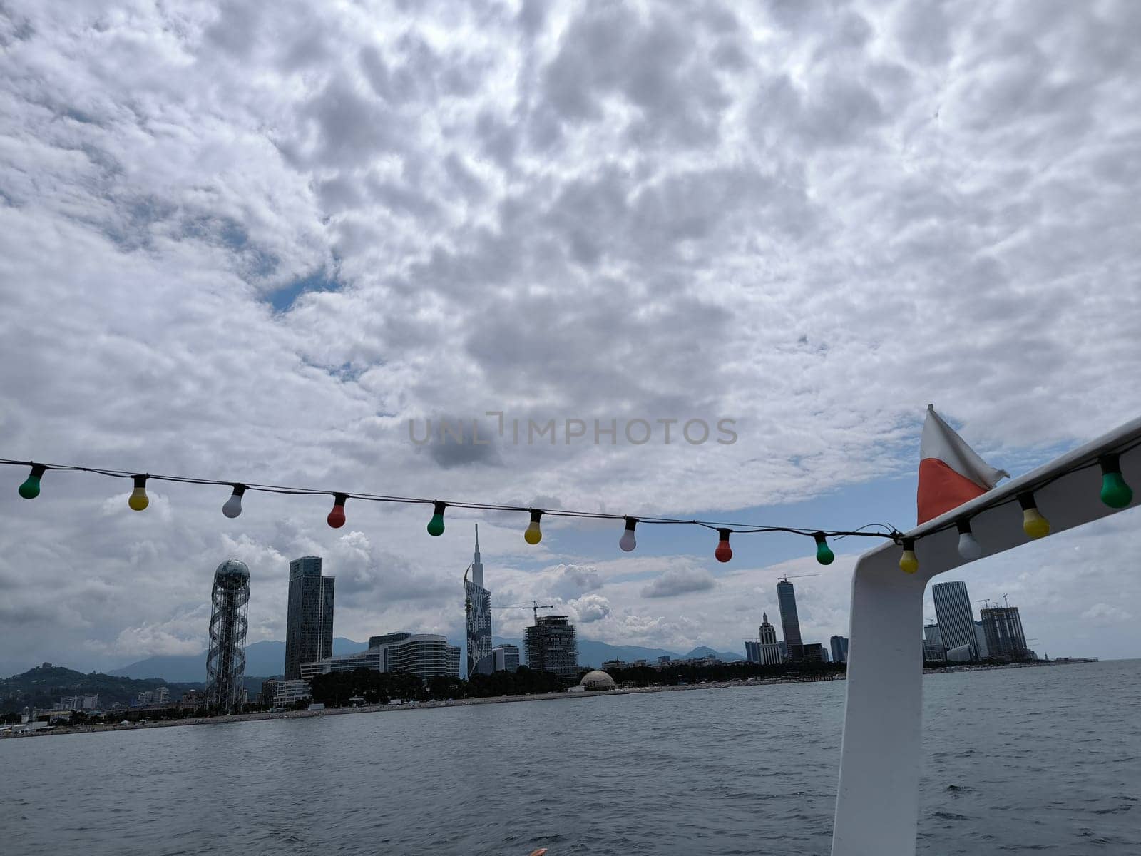 blue sea waves sky nature landscape water and white clouds. Batumi Georgia famous building beautiful evening city background. High quality photo