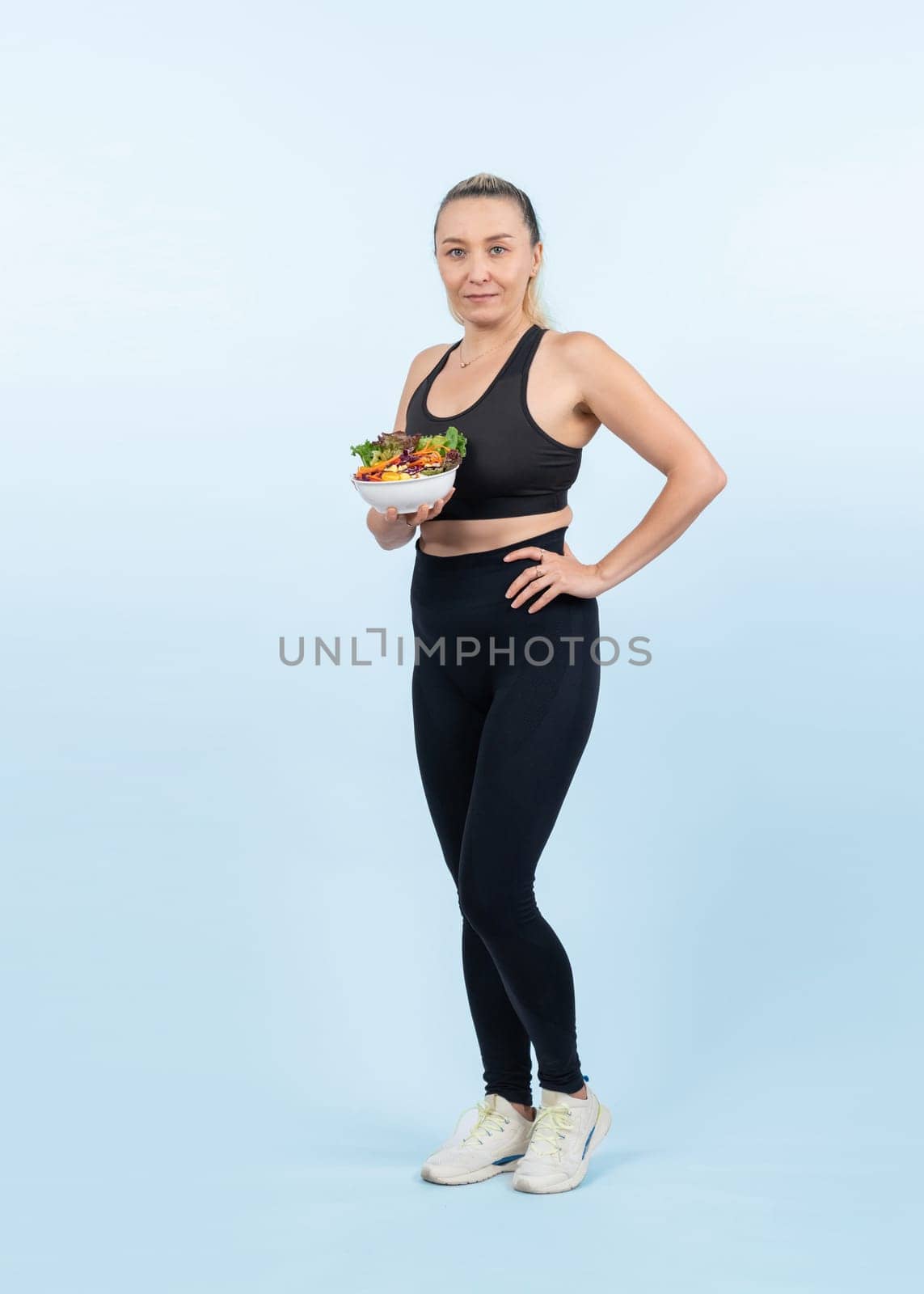 Happy smile senior woman portrait holding bowl of vegan fruit and vegetable on isolated background. Healthy senior people with healthy vegetarian nutrition and body care lifestyle. Clout